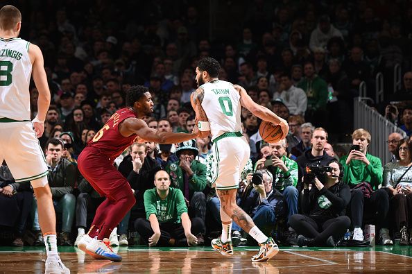 BOSTON, MA - DECEMBER 14: Jayson Tatum #0 of the Boston Celtics handles the ball against defender Donovan Mitchell #45 of the Cleveland Cavaliers during the game on December 14, 2023 at the TD Garden in Boston, Massachusetts. NOTE TO USER: User expressly acknowledges and agrees that, by downloading and or using this photograph, User is consenting to the terms and conditions of the Getty Images License Agreement. Mandatory Copyright Notice: Copyright 2023 NBAE  (Photo by Brian Babineau/NBAE via Getty Images)