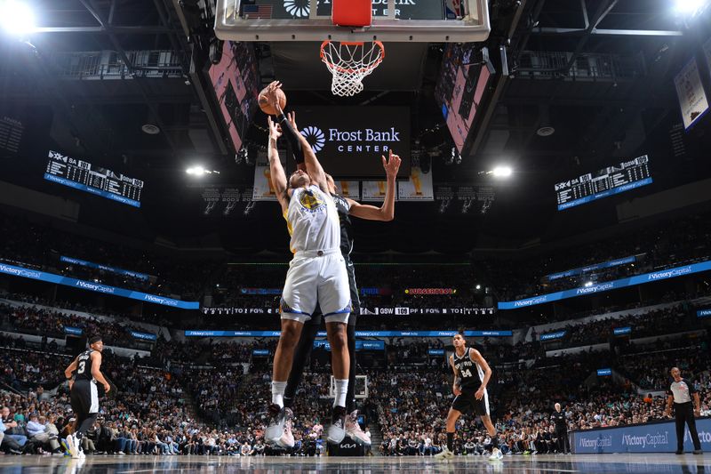 SAN ANTONIO, TX - MARCH 11:  Trayce Jackson-Davis #32 of the Golden State Warriors and Victor Wembanyama #1 of the San Antonio Spurs battle for a rebound on March 11, 2024 at the Frost Bank Center in San Antonio, Texas. NOTE TO USER: User expressly acknowledges and agrees that, by downloading and or using this photograph, user is consenting to the terms and conditions of the Getty Images License Agreement. Mandatory Copyright Notice: Copyright 2024 NBAE (Photos by Michael Gonzales/NBAE via Getty Images)