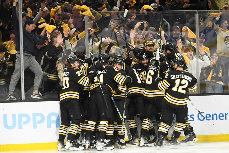 May 4, 2024; Boston, Massachusetts, USA; The Boston Bruins celebrate after defeating the Toronto Maple Leafs in overtime in game seven of the first round of the 2024 Stanley Cup Playoffs at TD Garden. Mandatory Credit: Bob DeChiara-USA TODAY Sports