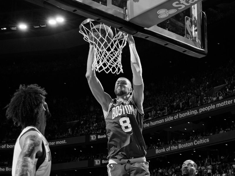 BOSTON, MA - JUNE 17: Kristaps Porzingis #8 of the Boston Celtics dunks the ball during the game against the Dallas Mavericks during Game 5 of the 2024 NBA Finals on June 17, 2024 at the TD Garden in Boston, Massachusetts. NOTE TO USER: User expressly acknowledges and agrees that, by downloading and or using this photograph, User is consenting to the terms and conditions of the Getty Images License Agreement. Mandatory Copyright Notice: Copyright 2024 NBAE  (Photo by Jesse D. Garrabrant/NBAE via Getty Images)