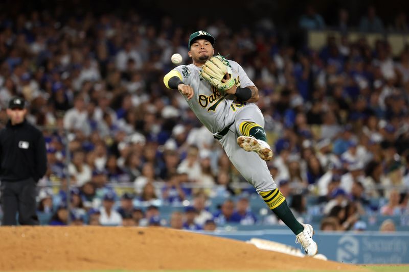 Aug 3, 2023; Los Angeles, California, USA;  Oakland Athletics third baseman Jordan Diaz (13) throws to first during the sixth inning against the Los Angeles Dodgers at Dodger Stadium. Mandatory Credit: Kiyoshi Mio-USA TODAY Sports