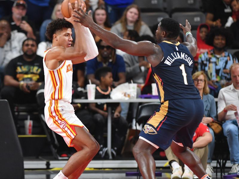 COLLEGE PARK, GEORGIA - OCTOBER 14: Zion Williamson #1 of the New Orleans Pelicans guards Jalen Johnson #1 of the Atlanta Hawks during a preseason game at Gateway Center Arena on October 14, 2023 in College Park, Georgia. NOTE TO USER: User expressly acknowledges and agrees that, by downloading and/or using this photograph, user is consenting to the terms and conditions of the Getty Images License Agreement (Photo by Paras Griffin/Getty Images)