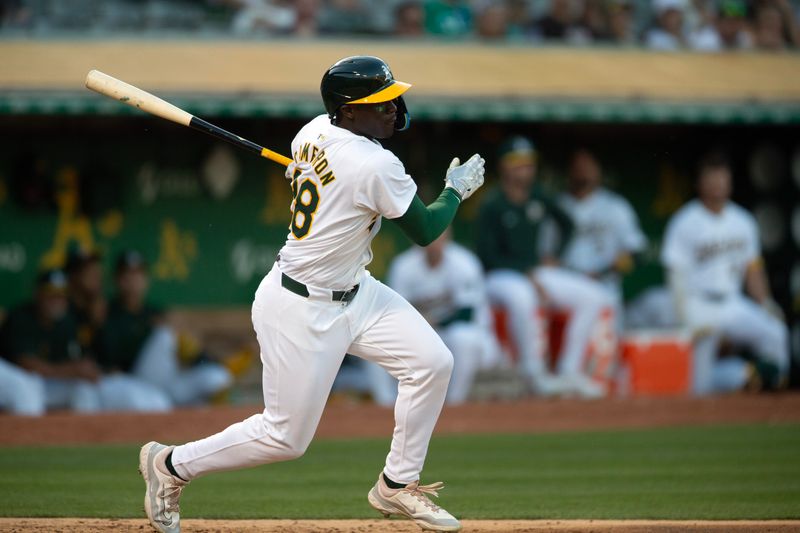 Jun 5, 2024; Oakland, California, USA; Oakland Athletics right fielder Daz Cameron (28) follows through on his single against the Seattle Mariners during the fifth inning at Oakland-Alameda County Coliseum. Mandatory Credit: D. Ross Cameron-USA TODAY Sports