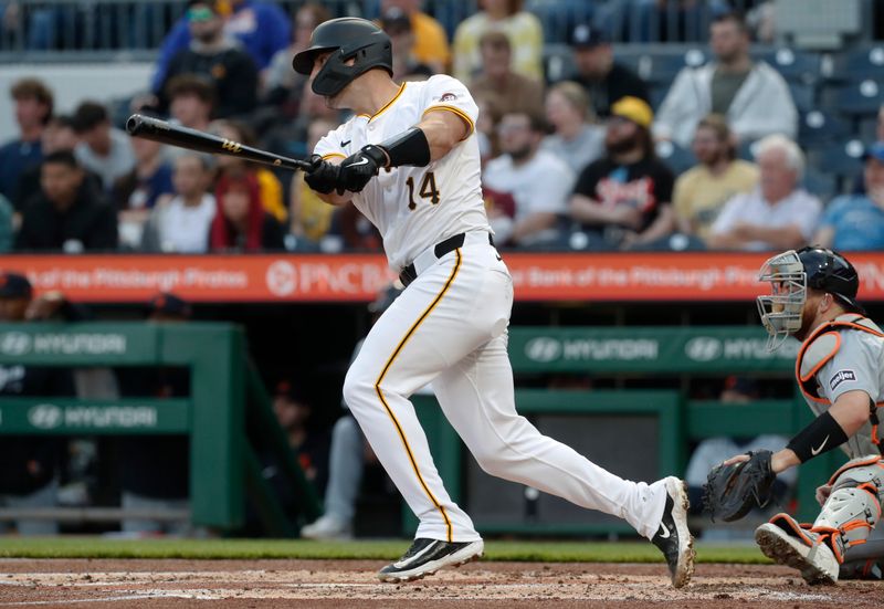 Apr 8, 2024; Pittsburgh, Pennsylvania, USA;  Pittsburgh Pirates catcher Joey Bart (14) hits a two run single against the Detroit Tigers during the second inning at PNC Park. Mandatory Credit: Charles LeClaire-USA TODAY Sports