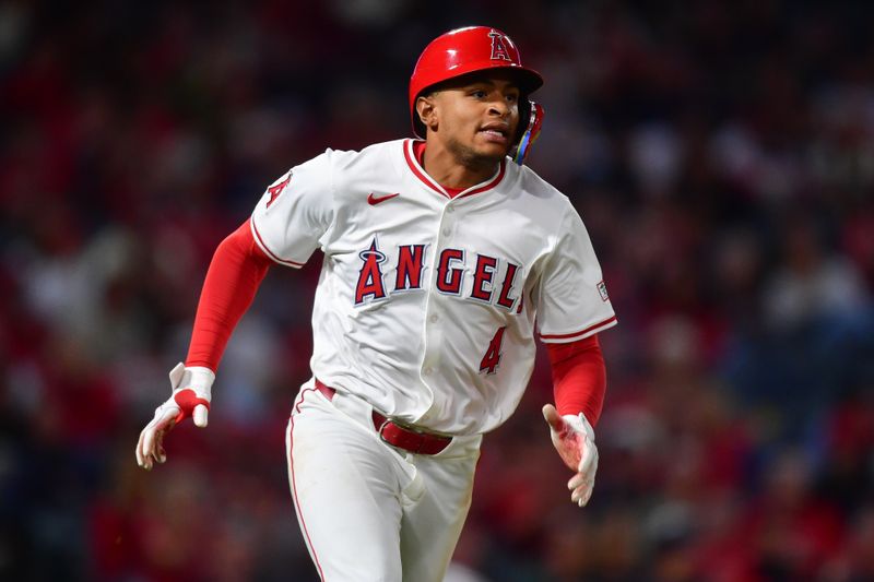 Sep 26, 2025; Anaheim, California, USA; Los Angeles Angels second baseman Christian Moore (4) runs after hitting a double against the Houston Astros during the fifth inning at Angel Stadium. Mandatory Credit: Gary A. Vasquez-Imagn Images