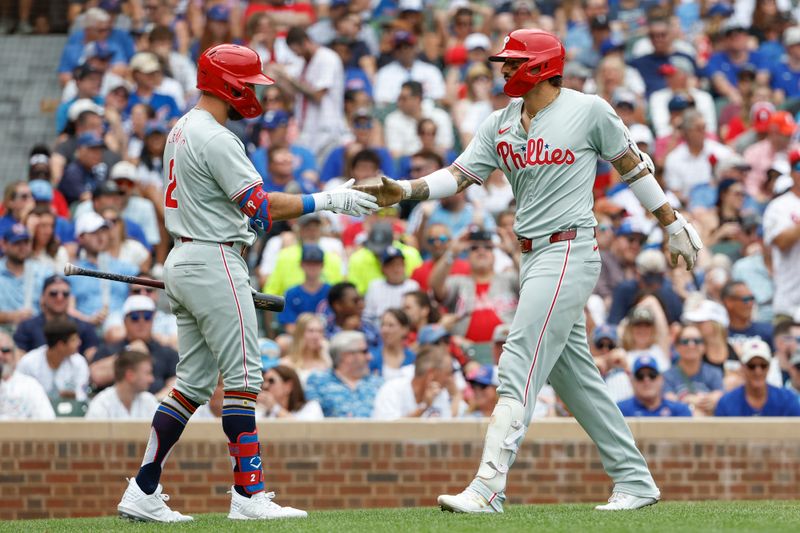 Jul 4, 2024; Chicago, Illinois, USA; Philadelphia Phillies outfielder Nick Castellanos (8) celebrates with second baseman Kody Clemens (2) after hitting a solo home run against the Chicago Cubs during the fourth inning at Wrigley Field. Mandatory Credit: Kamil Krzaczynski-USA TODAY Sports