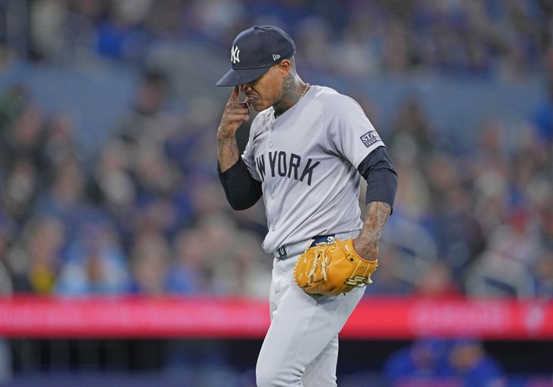 Apr 17, 2024; Toronto, Ontario, CAN; New York Yankees starting pitcher Marcus Stroman (0) walks towards the dugout after being relieved against the Toronto Blue Jays during the sixth inning at Rogers Centre. Mandatory Credit: Nick Turchiaro-USA TODAY Sports