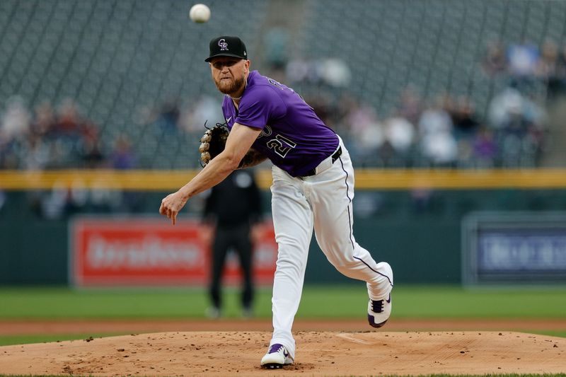 Apr 8, 2025; Denver, Colorado, USA; Colorado Rockies starting pitcher Kyle Freeland (21) pitches in the first inning against the Milwaukee Brewers at Coors Field. Mandatory Credit: Isaiah J. Downing-Imagn Images