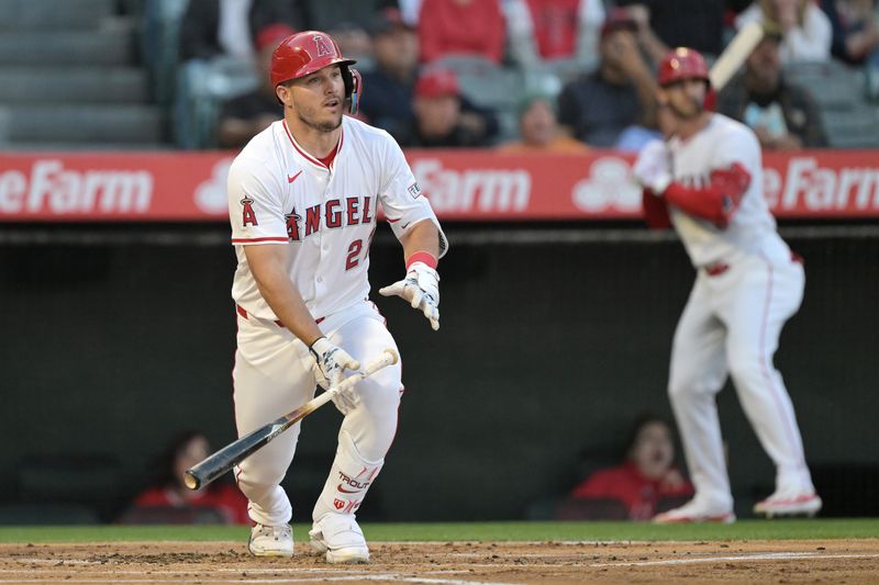 Apr 8, 2024; Anaheim, California, USA; Los Angeles Angels outfielder Mike Trout (27) hits a RBI triple in the first inning against the Tampa Bay Rays at Angel Stadium. Mandatory Credit: Jayne Kamin-Oncea-USA TODAY Sports