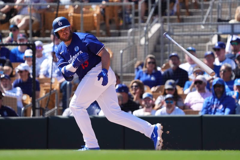 Mar 9, 2024; Phoenix, Arizona, USA; Los Angeles Dodgers third baseman Max Muncy (13) draws a walk against the Texas Rangers during the first inning at Camelback Ranch-Glendale. Mandatory Credit: Joe Camporeale-USA TODAY Sports