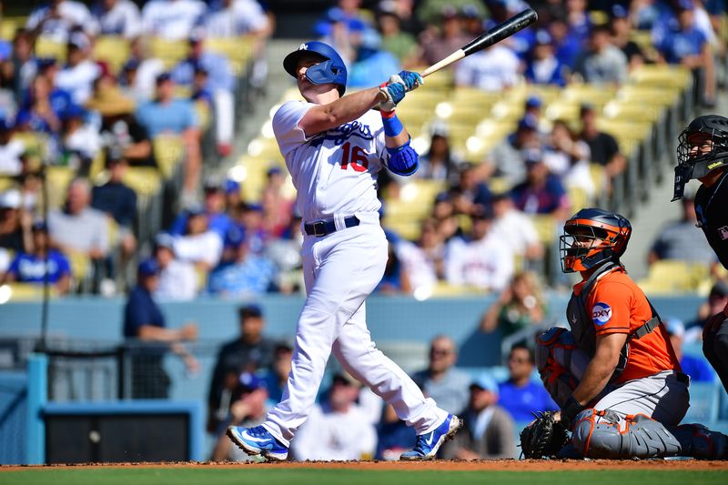 Jun 24, 2023; Los Angeles, California, USA; Los Angeles Dodgers catcher Will Smith (16) hits a solo home run against the Houston Astros during the first inning at Dodger Stadium. Mandatory Credit: Gary A. Vasquez-USA TODAY Sports