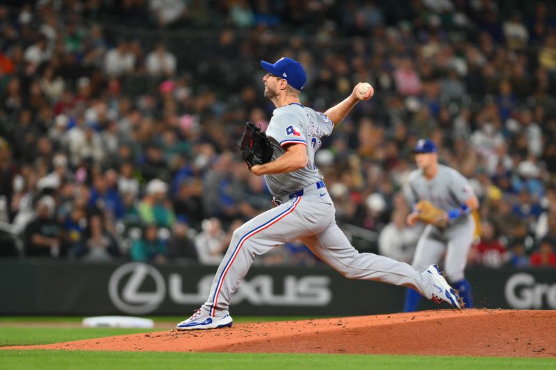 Sep 14, 2024; Seattle, Washington, USA; Texas Rangers starting pitcher Max Scherzer (31) pitches to the Seattle Mariners during the first inning at T-Mobile Park. Mandatory Credit: Steven Bisig-Imagn Images