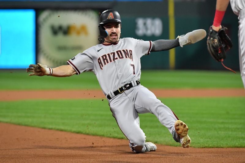 Oct 24, 2023; Philadelphia, Pennsylvania, USA; Arizona Diamondbacks left fielder Corbin Carroll (7) slides safely into third base against the Philadelphia Phillies in the first inning during game seven of the NLCS for the 2023 MLB playoffs at Citizens Bank Park. Mandatory Credit: Eric Hartline-USA TODAY Sports