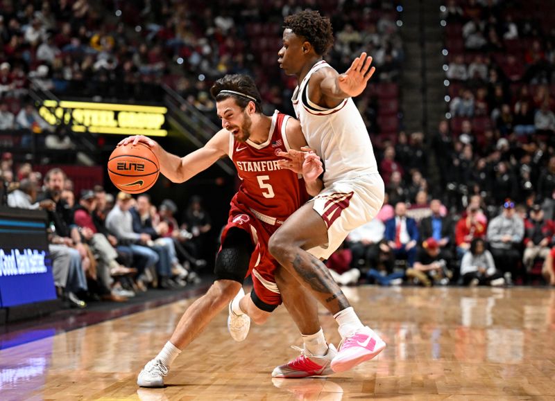 Jan 31, 2026; Tallahassee, Florida, USA; Stanford Cardinal guard Benny Gealer (5) is defended by Florida State Seminoles forward Thomas Bassong (3) during the first half at Donald L. Tucker Center. Mandatory Credit: Melina Myers-Imagn Images