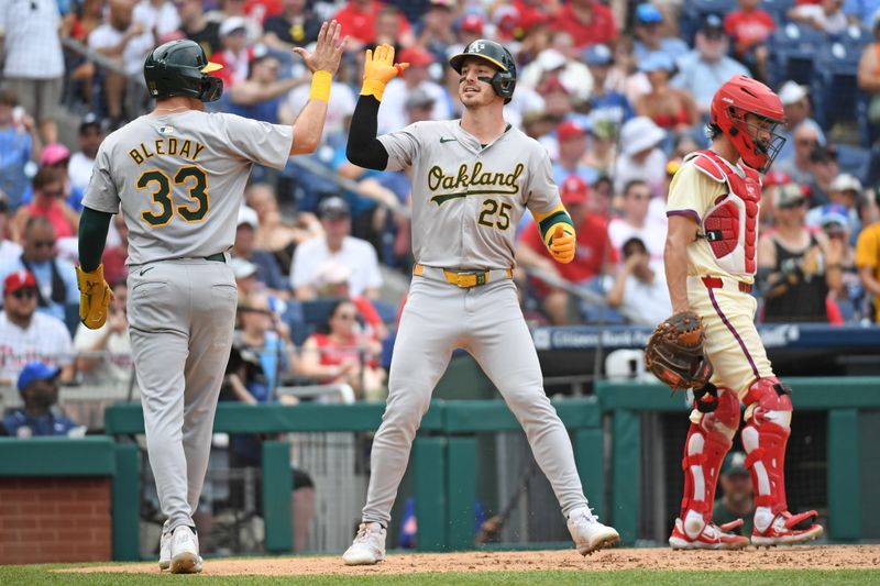 Jul 14, 2024; Philadelphia, Pennsylvania, USA; Oakland Athletics outfielder Brent Rooker (25) celebrates with  outfielder JJ Bleday (33) after hitting a two-run home run against Philadelphia Phillies during the sixth inning at Citizens Bank Park. Mandatory Credit: Eric Hartline-USA TODAY Sports