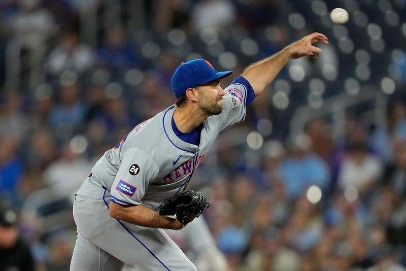 Sep 10, 2024; Toronto, Ontario, CAN; New York Mets starting pitcher David Peterson (23) pitches to the Toronto Blue Jays during the second inning at Rogers Centre. Mandatory Credit: John E. Sokolowski-Imagn Images