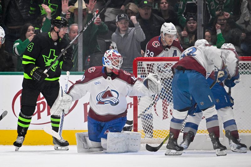 Nov 29, 2024; Dallas, Texas, USA; Dallas Stars defenseman Miro Heiskanen (4) looks on as left wing Mason Marchment (not pictured) scores a goal against Colorado Avalanche goaltender Alexandar Georgiev (40) during the first period at the American Airlines Center. Mandatory Credit: Jerome Miron-Imagn Images