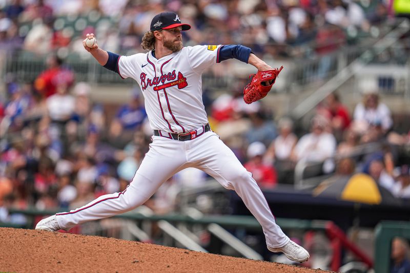 Apr 20, 2025; Cumberland, Georgia, USA; Atlanta Braves relief pitcher Pierce Johnson (38) pitches against the Minnesota Twins during the eighth inning at Truist Park. Mandatory Credit: Dale Zanine-Imagn Images