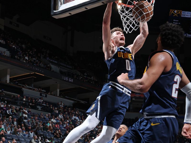MINNEAPOLIS, MN -  OCTOBER 17: Christian Braun #0 of the Denver Nuggets dunks the ball during the game against the Minnesota Timberwolves during the 2024 NBA Preseason on October 17, 2024 at Target Center in Minneapolis, Minnesota. NOTE TO USER: User expressly acknowledges and agrees that, by downloading and or using this Photograph, user is consenting to the terms and conditions of the Getty Images License Agreement. Mandatory Copyright Notice: Copyright 2024 NBAE (Photo by David Sherman/NBAE via Getty Images)