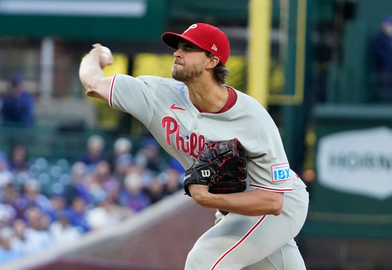 Apr 27, 2025; Chicago, Illinois, USA; Philadelphia Phillies pitcher Aaron Nola (27) throws the ball against the Chicago Cubs during the first inning at Wrigley Field. Mandatory Credit: David Banks-Imagn Images