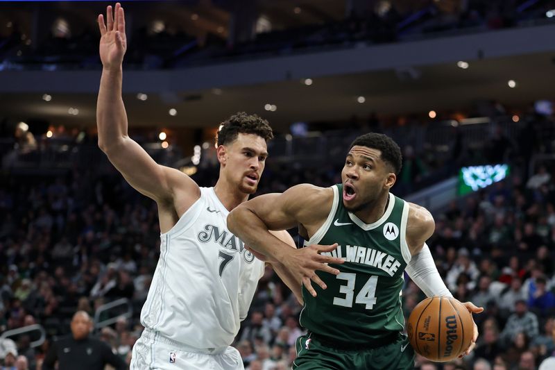 MILWAUKEE, WISCONSIN - MARCH 05: Giannis Antetokounmpo #34 of the Milwaukee Bucks is defended by Dwight Powell #7 of the Dallas Mavericks during the first half of a game at Fiserv Forum on March 05, 2025 in Milwaukee, Wisconsin. NOTE TO USER: User expressly acknowledges and agrees that, by downloading and or using this photograph, User is consenting to the terms and conditions of the Getty Images License Agreement. (Photo by Stacy Revere/Getty Images)