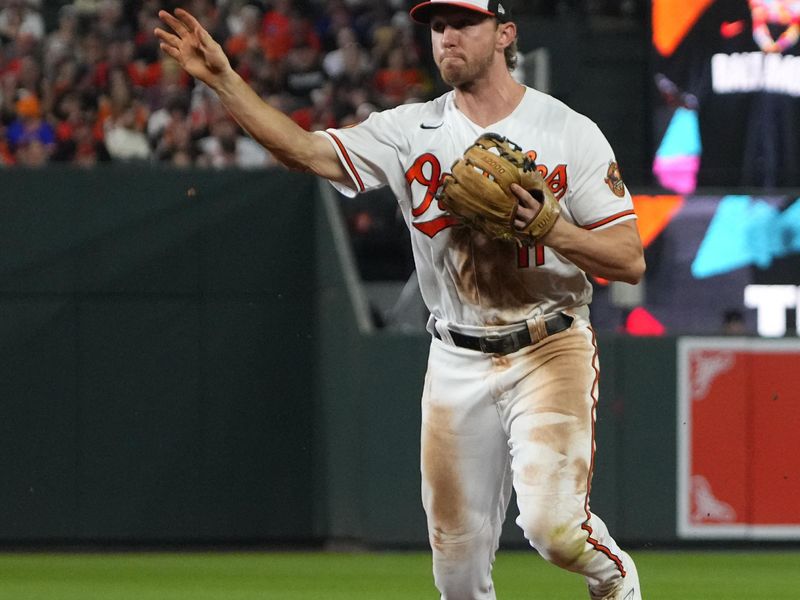 Aug 5, 2023; Baltimore, Maryland, USA; Baltimore Orioles second baseman Jordan Westburg(11) throws out New York Mets right fielder Starling Marte (not pictured) after fielding a ground ball during the seventh inning at Oriole Park at Camden Yards. Mandatory Credit: Gregory Fisher-USA TODAY Sports