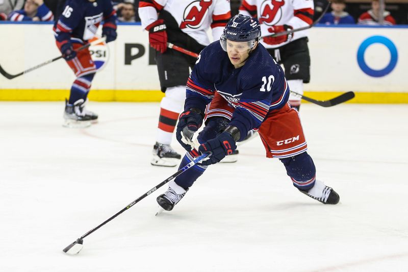 Apr 3, 2024; New York, New York, USA; New York Rangers left wing Artemi Panarin (10) chases the puck in the third period against the New Jersey Devils at Madison Square Garden. Mandatory Credit: Wendell Cruz-USA TODAY Sports