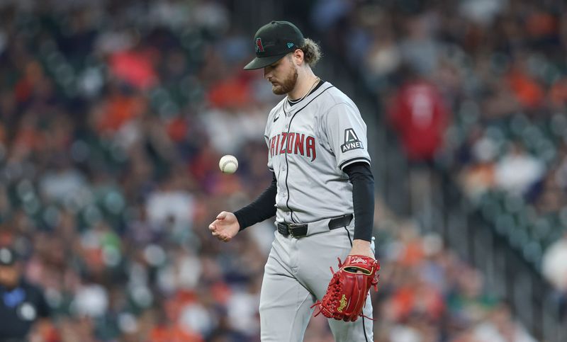 Sep 8, 2024; Houston, Texas, USA; Arizona Diamondbacks starting pitcher Ryne Nelson (19) reacts after a pitch during the first inning against the Houston Astros at Minute Maid Park. Mandatory Credit: Troy Taormina-Imagn Images