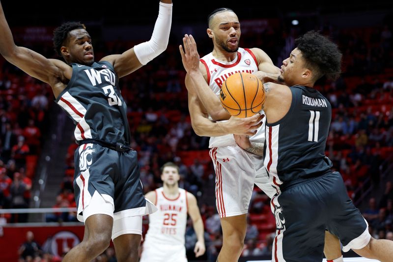 Jan 19, 2023; Salt Lake City, Utah, USA;  Utah Utes guard Marco Anthony (10) battles against Washington State Cougars guard Kymany Houinsou (31) and Washington State Cougars forward DJ Rodman (11) in the second half at Jon M. Huntsman Center. Mandatory Credit: Jeffrey Swinger-USA TODAY Sports