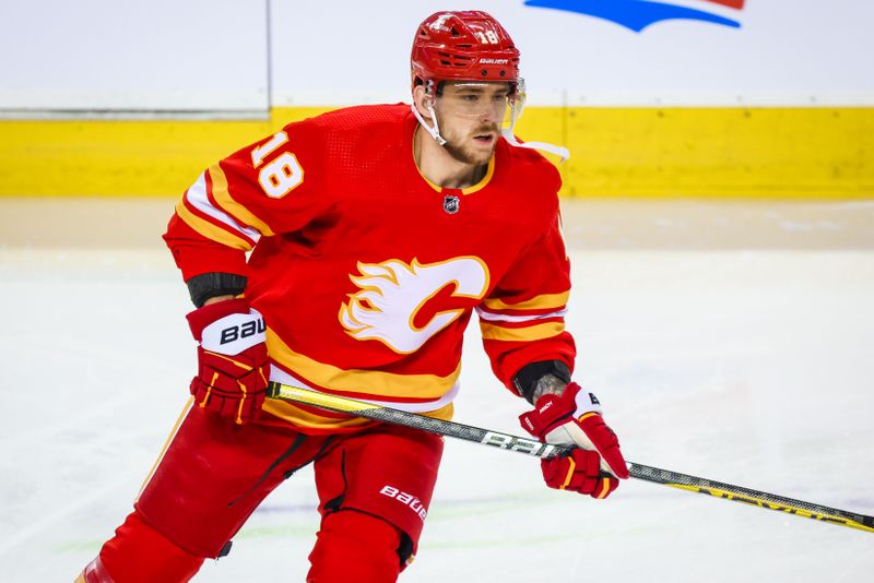 Nov 30, 2023; Calgary, Alberta, CAN; Calgary Flames left wing A.J. Greer (18) skates during the warmup period against the Dallas Stars at Scotiabank Saddledome. Mandatory Credit: Sergei Belski-USA TODAY Sports