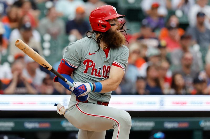 Jun 26, 2024; Detroit, Michigan, USA;  Philadelphia Phillies left fielder Brandon Marsh (16) hits a two RBI single against the Detroit Tigers in the fifth inning at Comerica Park. Mandatory Credit: Rick Osentoski-USA TODAY Sports