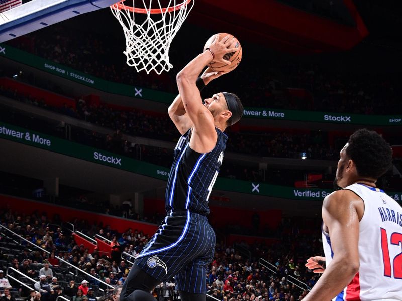 DETROIT, MI - JANUARY 1: Jalen Suggs #4 of the Orlando Magic dunks the ball during the game against the Detroit Pistons on January 1, 2025 at Little Caesars Arena in Detroit, Michigan. NOTE TO USER: User expressly acknowledges and agrees that, by downloading and/or using this photograph, User is consenting to the terms and conditions of the Getty Images License Agreement. Mandatory Copyright Notice: Copyright 2025 NBAE (Photo by Chris Schwegler/NBAE via Getty Images)