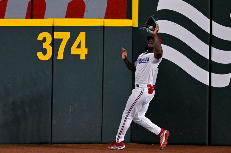 May 16, 2023; Arlington, Texas, USA; Texas Rangers right fielder Adolis Garcia (53) catches a fly ball hit by Atlanta Braves designated hitter Eddie Rosario (not pictured) during the sixth inning at Globe Life Field. Mandatory Credit: Jerome Miron-USA TODAY Sports