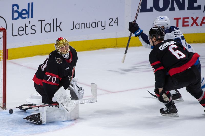 Jan 20, 2024; Ottawa, Ontario, CAN; Winnipeg Jets left wing Nikolaj Ehlers (27) scores against Ottawa Senators goalie Joonas Koprpisalo (70) in overtime at the Canadian Tire Centre. Mandatory Credit: Marc DesRosiers-USA TODAY Sports