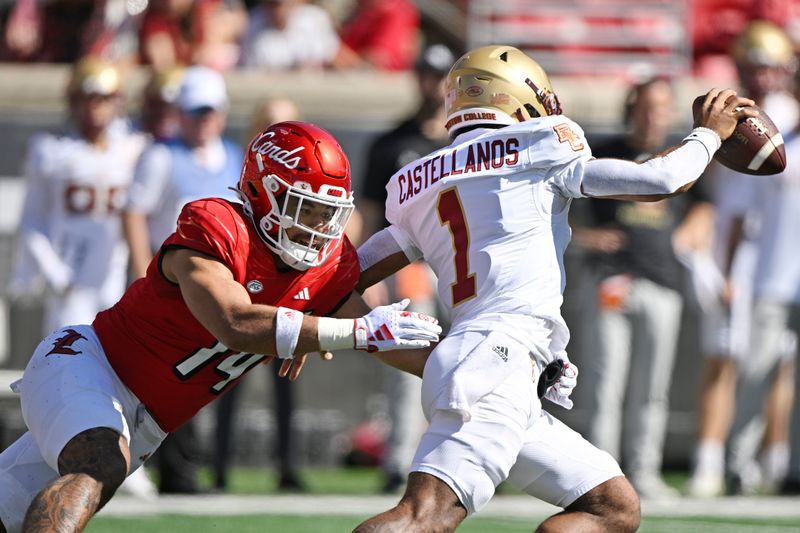 Sep 23, 2023; Louisville, Kentucky, USA;  Louisville Cardinals defensive lineman Stephen Herron (14) attempts to sack Boston College Eagles quarterback Thomas Castellanos (1) during the first quarter at L&N Federal Credit Union Stadium. Mandatory Credit: Jamie Rhodes-USA TODAY Sports