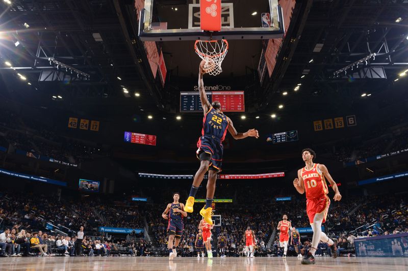 SAN FRANCISCO, CA - NOVEMBER 20: Andrew Wiggins #22 of the Golden State Warriors drives to the basket during the game against the Atlanta Hawks on November 20, 2024 at Chase Center in San Francisco, California. NOTE TO USER: User expressly acknowledges and agrees that, by downloading and or using this photograph, user is consenting to the terms and conditions of Getty Images License Agreement. Mandatory Copyright Notice: Copyright 2024 NBAE (Photo by Noah Graham/NBAE via Getty Images)