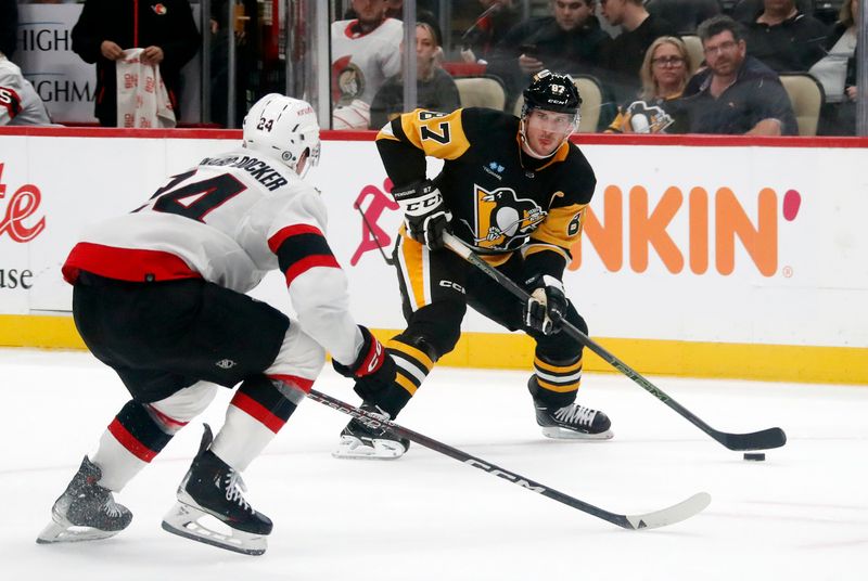 Oct 28, 2023; Pittsburgh, Pennsylvania, USA; Pittsburgh Penguins center Sidney Crosby (87) carries the puck as Ottawa Senators defenseman Jacob Bernard-Docker (24) defends during the first period at PPG Paints Arena. Mandatory Credit: Charles LeClaire-USA TODAY Sports