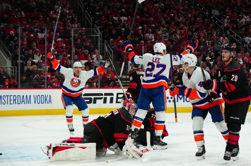 Apr 22, 2024; Raleigh, North Carolina, USA; New York Islanders left wing Anders Lee (27) celebrates his goal past Carolina Hurricanes goaltender Frederik Andersen (31) during the second period in game two of the first round of the 2024 Stanley Cup Playoffs at PNC Arena. Mandatory Credit: James Guillory-USA TODAY Sports