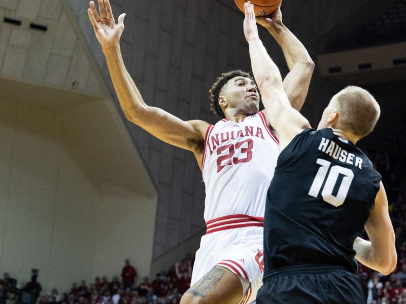 Jan 22, 2023; Bloomington, Indiana, USA; Indiana Hoosiers forward Trayce Jackson-Davis (23) shoots the ball while Michigan State Spartans forward Joey Hauser (10)  defends in the first half at Simon Skjodt Assembly Hall. Mandatory Credit: Trevor Ruszkowski-USA TODAY Sports