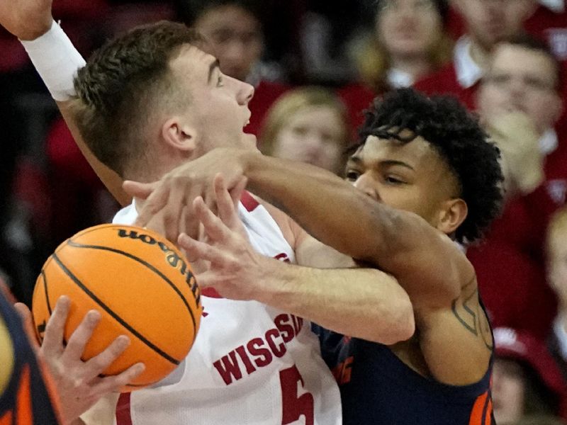 Jan 1, 2023; Madison, Wis, USA; Wisconsin forward Tyler Wahl (5) is guarded by Illinois guard Terrence Shannon Jr. (0) during the first half of their game at the Kohl Center. Mandatory Credit: Mark Hoffman/Milwaukee Journal Sentinel via USA TODAY NETWORK