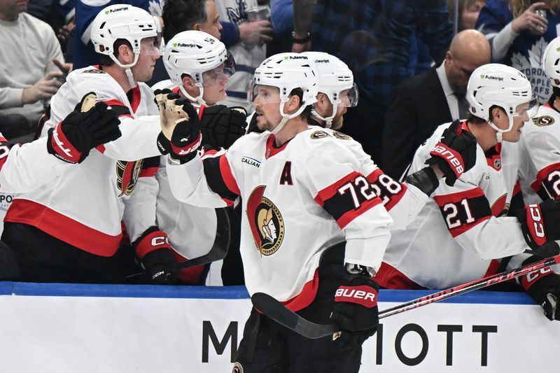 Feb 28, 2026; Toronto, Ontario, CAN;  Ottawa Senators defenseman Thomas Chabot (72) celebrates with team mates at the bench after scoring a goal against the Toronto Maple Leafs in the first period at Scotiabank Arena. Mandatory Credit: Dan Hamilton-Imagn Images