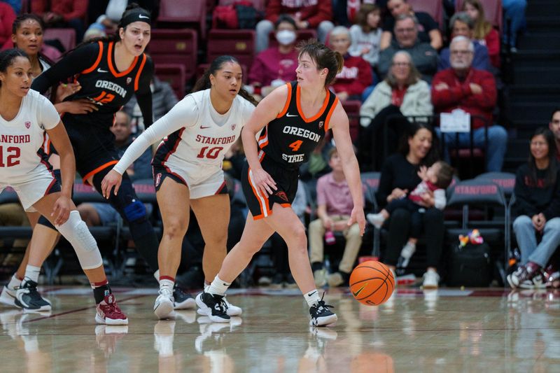 Jan 27, 2023; Stanford, California, USA; Oregon State Beavers guard Noelle Mannen (4) dribbles the basketball against Stanford Cardinal guard Talana Lepolo (10) during the second quarter at Maples Pavilion. Mandatory Credit: Neville E. Guard-USA TODAY Sports