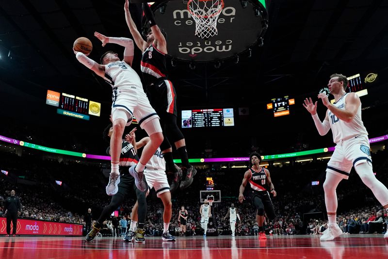 PORTLAND, OREGON - NOVEMBER 10: Jake LaRavia #3 of the Memphis Grizzlies shoots under pressure from Deni Avdija #8 of the Portland Trail Blazers during the second half at Moda Center on November 10, 2024 in Portland, Oregon. NOTE TO USER: User expressly acknowledges and agrees that, by downloading and or using this photograph, User is consenting to the terms and conditions of the Getty Images License Agreement. (Photo by Soobum Im/Getty Images)