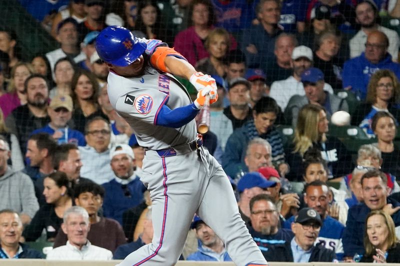 Sep 25, 2025; Chicago, Illinois, USA; New York Mets outfielder Tyrone Taylor (15) hits a two-run double against the Chicago Cubs during the sixth inning at Wrigley Field. Mandatory Credit: David Banks-Imagn Images