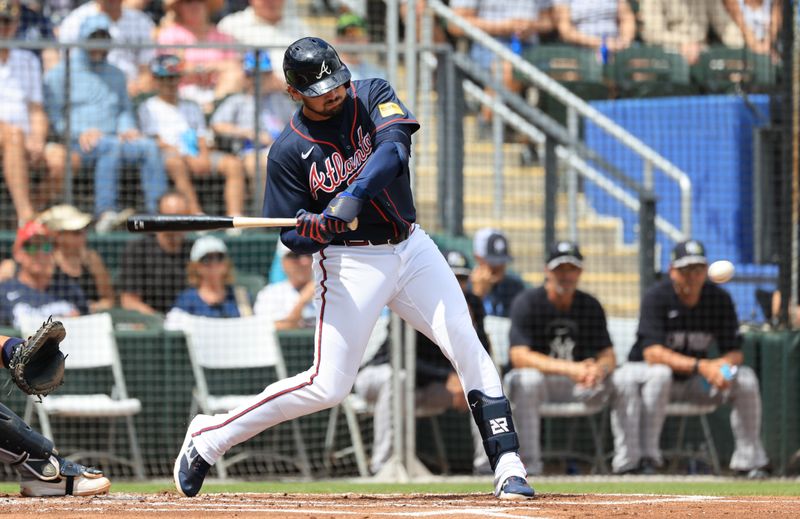 Mar 13, 2026; North Port, Florida, USA;  Atlanta Braves third baseman Austin Riley (27) hits an RBI single during the first inning against the New York Yankees at CoolToday Park. Mandatory Credit: Kim Klement Neitzel-Imagn Images