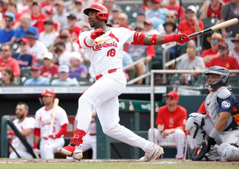 Mar 7, 2024; Jupiter, Florida, USA; St. Louis Cardinals right fielder Jordan Walker (18) follows through on his home run against the Houston Astros  in the second inning at Roger Dean Chevrolet Stadium. Mandatory Credit: Rhona Wise-USA TODAY Sports