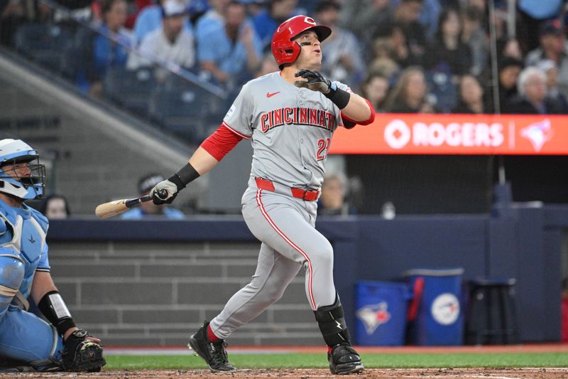 Aug 19, 2024; Toronto, Ontario, CAN; Cincinnati Reds center fielder TJ Friedl (29) hits a solo home run against the Toronto Blue Jays in the fourth inning at Rogers Centre. Mandatory Credit: Dan Hamilton-USA TODAY Sports