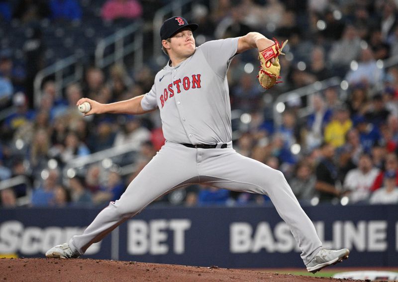 Sep 25, 2024; Toronto, Ontario, CAN;  Boston Red Sox starting pitcher Richard Pitts (80) delivers a pitch against the Toronto Blue Jays in the first inning at Rogers Centre. Mandatory Credit: Dan Hamilton-Imagn Images