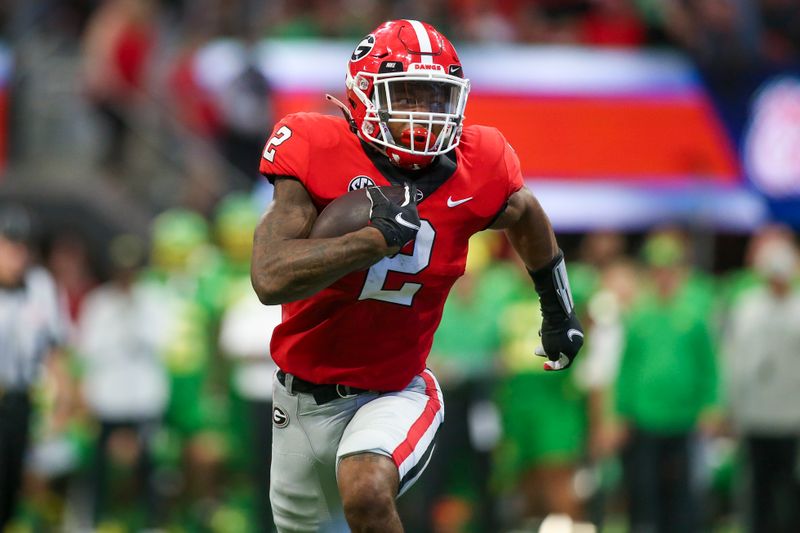 Sep 3, 2022; Atlanta, Georgia, USA; Georgia Bulldogs running back Kendall Milton (2) runs the ball against the Oregon Ducks in the second quarter at Mercedes-Benz Stadium. Mandatory Credit: Brett Davis-USA TODAY Sports