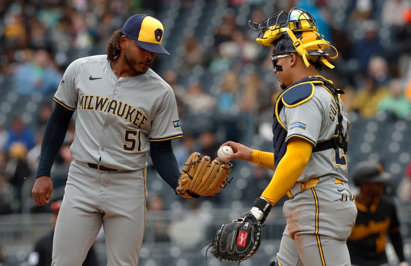 Apr 25, 2024; Pittsburgh, Pennsylvania, USA; Milwaukee Brewers catcher William Contreras (24) brings a new ball to pitcher Freddy Peralta (51)  against the Pittsburgh Pirates during the fourth inning at PNC Park. Mandatory Credit: Charles LeClaire-USA TODAY Sports